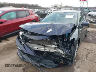 2021 Toyota Camry Hybrid LE with VIN 4T1C31AKXMU565585, listed as a IAAI auction lot 41057955 with 31,976 mi miles. Bid and sale history available at carsss.com. Image 2.