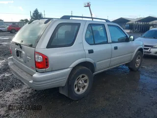 2000 Isuzu Rodeo z VIN 4S2DM58W9Y4301998, wystawiony jako IAAI lot #41265011 z przebiegiem 222 659 mil mil oraz . Historia ofert i sprzedaży dostępna na DreamBid. Obrazek 4.