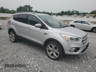 2019 Ford Escape Titanium with VIN 1FMCU9J90KUA07976, listed as a Copart auction lot 59565275 with 189,655 mi miles and Salvage title. Bid and sale history available at DreamBid. Image 4.