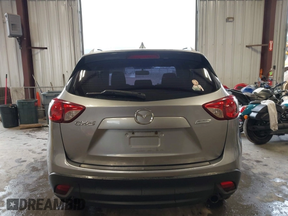 2015 Mazda CX-5 Sport z VIN JM3KE2BE8F0434889, wystawiony jako IAAI lot #42259894 z przebiegiem 298 835 mil mil oraz . Historia ofert i sprzedaży dostępna na DreamBid. Obrazek 16.