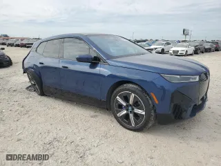 2023 BMW iX M60 with VIN WB533CF01PCM29925, listed as a Copart auction lot 54160244 with 8,226 mi miles and Salvage Title. Bid and sale history available at carsss.com. Image 4.
