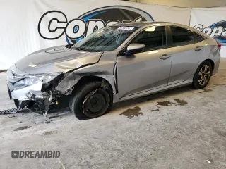 2017 Honda Civic LX z VIN 19XFC2F5XHE015432, wystawiony jako Copart lot #58214025 z przebiegiem 137 584 mil mil oraz Czysty tytuł • Clean title. Historia ofert i sprzedaży dostępna na DreamBid. Obrazek 1.