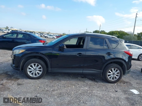 2014 Mazda CX-5 Touring with VIN JM3KE2CYXE0384987, listed as a IAAI auction lot 42052196 with 151,765 mi miles. Bid and sale history available at carsss.com. Image 14.