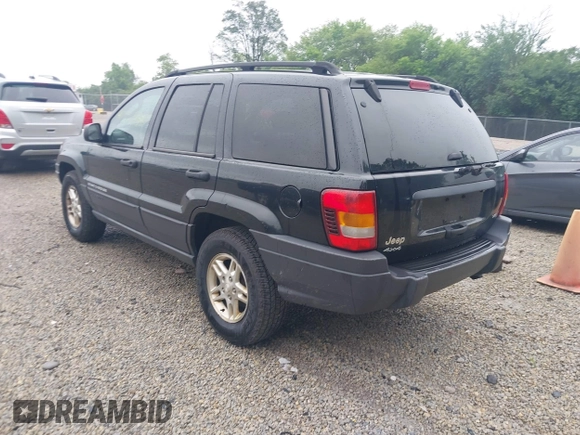 2003 Jeep Grand Cherokee Laredo with VIN 1J4GW48NX3C532874, listed as a IAAI auction lot 42613091 with 165,920 mi miles and . Bid and sale history available at DreamBid. Image 3.