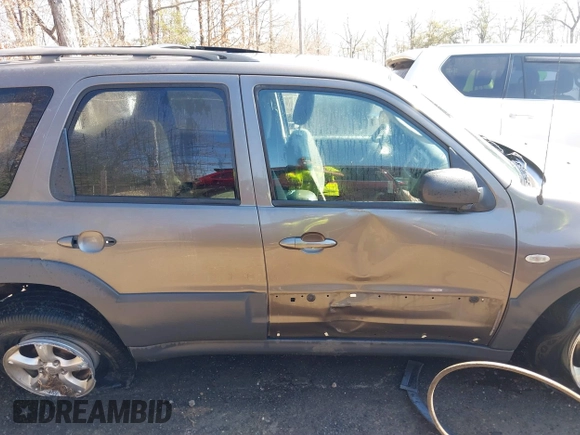 2006 Mazda Tribute i with VIN 4F2YZ92Z16KM25216, listed as a IAAI auction lot 41664006 with 228,222 mi miles and . Bid and sale history available at carsss.com. Image 13.