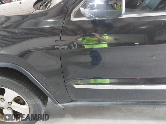 2012 Jeep Grand Cherokee Laredo with VIN 1C4RJFAT8CC182128, listed as a IAAI auction lot 40154044 with 239,601 mi miles. Bid and sale history available at carsss.com. Image 6.