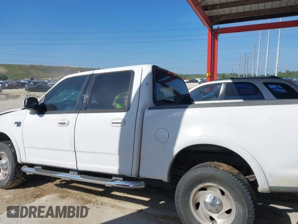 2003 Ford F-150 XLT with VIN 1FTRW08L63KA28964, listed as a IAAI auction lot 41689700 with 303,789 mi miles. Bid and sale history available at carsss.com. Image 15.