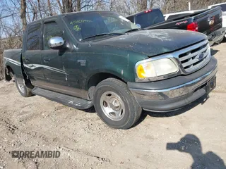 2002 Ford F-150 XLT with VIN 1FTRW07672KB47813, listed as a IAAI auction lot 41788462 with 234,684 mi miles. Bid and sale history available at carsss.com. Image 1.