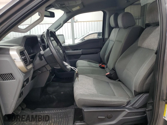2021 Ford F-150 XL with VIN 1FTMF1EP7MKE58611, listed as a Copart auction lot 56912955 with 30,850 mi miles and Salvage title. Bid and sale history available at DreamBid. Image 7.
