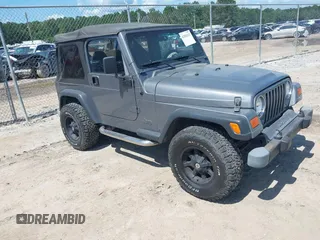 2002 Jeep Wrangler Sport with VIN 1J4FA49S62P731507, listed as a IAAI auction lot 42584222 with 206,661 mi miles and . Bid and sale history available at DreamBid. Image 1.