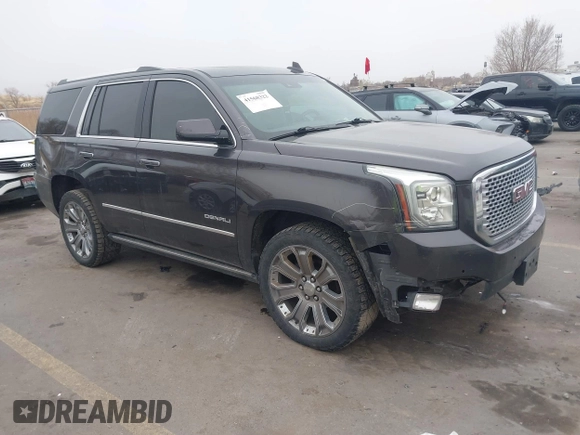 2015 GMC Yukon Denali with VIN 1GKS2CKJ2FR705806, listed as a IAAI auction lot 41568322 with 171,011 mi miles. Bid and sale history available at carsss.com. Image 1.