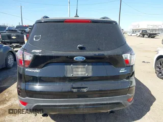 2018 Ford Escape SE z VIN 1FMCU9GD3JUC75754, wystawiony jako IAAI lot #41761965 z przebiegiem 101 771 mil mil oraz . Historia ofert i sprzedaży dostępna na DreamBid. Obrazek 16.