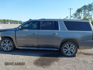 2019 Chevrolet Suburban LT with VIN 1GNSCJKC3KR129739, listed as a IAAI auction lot 42044708 with 105,771 mi miles and . Bid and sale history available at DreamBid. Image 14.