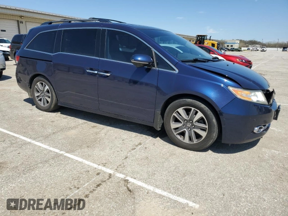 2014 Honda Odyssey Touring with VIN 5FNRL5H96EB068651, listed as a Copart auction lot 51649735 with 157,213 mi miles and Salvage title. Bid and sale history available at DreamBid. Image 4.