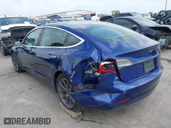 2019 Tesla Model 3 Mid Range with VIN 5YJ3E1EA5KF190453, listed as a IAAI auction lot 41880684 with 58,909 mi miles and . Bid and sale history available at carsss.com. Image 6.