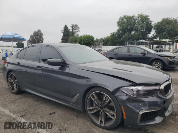 2019 BMW 5 Series M550i xDrive with VIN WBAJB9C59KB287501, listed as a Copart auction lot 59732425 with 74,345 mi miles and Salvage title. Bid and sale history available at DreamBid. Image 4.