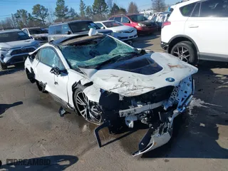 2015 BMW i8 with VIN WBY2Z2C51FV392854, listed as a IAAI auction lot 41282895 with 77,533 mi miles. Bid and sale history available at carsss.com. Image 1.