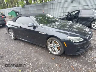 2017 BMW 6 Series 650i xDrive z VIN WBA6F7C52HD930816, wystawiony jako IAAI lot #42168478 z przebiegiem 89 191 mil mil oraz . Historia ofert i sprzedaży dostępna na DreamBid. Obrazek 1.