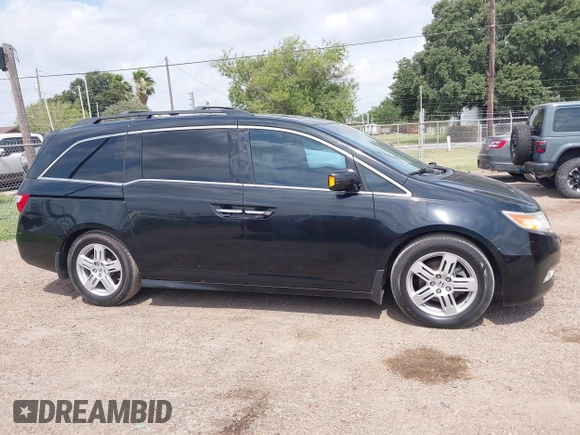2013 Honda Odyssey Touring with VIN 5FNRL5H95DB086041, listed as a IAAI auction lot 42477974 with 213,343 mi miles and . Bid and sale history available at DreamBid. Image 13.