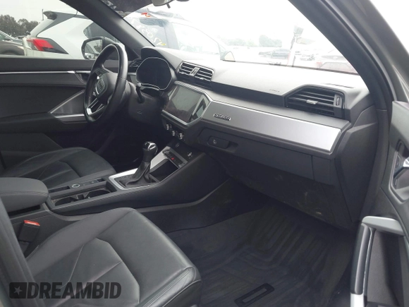 2020 Audi Q3 Premium with VIN WA1AECF32L1061271, listed as a IAAI auction lot 42038795 with 23,902 mi miles and . Bid and sale history available at DreamBid. Image 5.