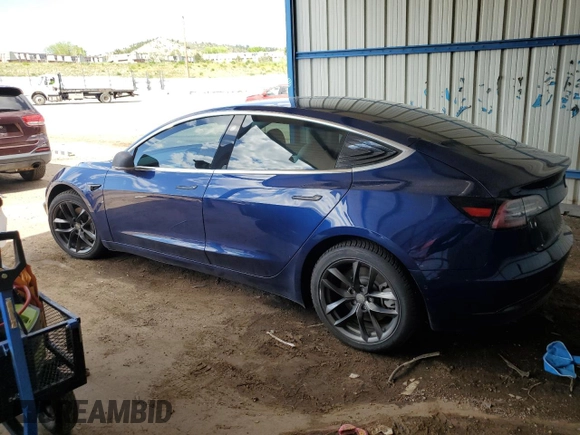 2018 Tesla Model 3 Long Range Battery z VIN 5YJ3E1EB3JF134664, wystawiony jako Copart lot #57288485 z przebiegiem Nie podano mil oraz Szkoda całkowita • Salvage title. Historia ofert i sprzedaży dostępna na DreamBid. Obrazek 2.