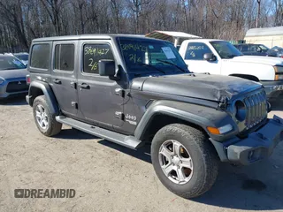 2018 Jeep Wrangler Unlimited Sport S with VIN 1C4HJXDG6JW110338, listed as a IAAI auction lot 39819803 with 100,514 mi miles and . Bid and sale history available at DreamBid. Image 1.