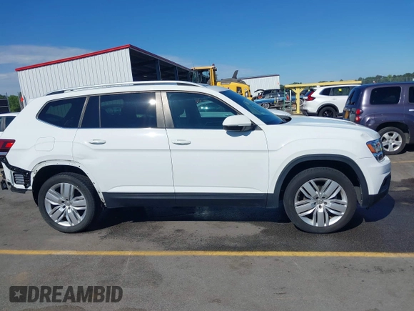 2019 Volkswagen Atlas SE z VIN 1V2WR2CA3KC503490, wystawiony jako IAAI lot #42168340 z przebiegiem 70 868 mil mil oraz . Historia ofert i sprzedaży dostępna na DreamBid. Obrazek 14.