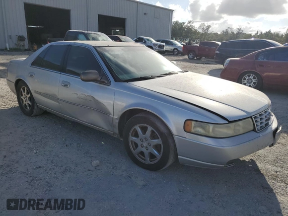 2003 Cadillac Seville Touring STS z VIN 1G6KY54923U101998, wystawiony jako Copart lot #74029304 z przebiegiem 134 157 mil mil oraz Szkoda całkowita • Salvage title. Historia ofert i sprzedaży dostępna na DreamBid. Obrazek 4.