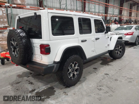 2021 Jeep Wrangler Unlimited Rubicon with VIN 1C4HJXFN2MW809904, listed as a IAAI auction lot 41567956 with 34,000 mi miles and . Bid and sale history available at DreamBid. Image 4.