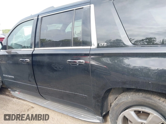 2015 Chevrolet Suburban LTZ with VIN 1GNSKKKC6FR637086, listed as a IAAI auction lot 42104826 with 79,986 mi miles and . Bid and sale history available at DreamBid. Image 14.