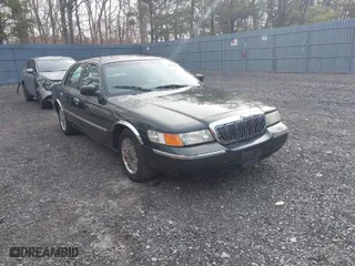 1999 Mercury Grand Marquis GS with VIN 2MEFM74W1XX611123, listed as a IAAI auction lot 41917606 with 82,619 mi miles. Bid and sale history available at carsss.com. Image 1.