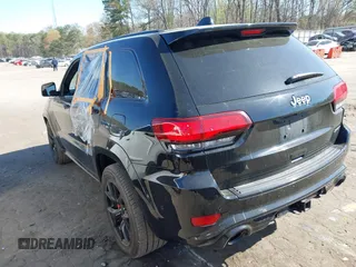 2017 Jeep Grand Cherokee SRT with VIN 1C4RJFDJ2HC696025, listed as a IAAI auction lot 41863274 with 126,949 mi miles. Bid and sale history available at carsss.com. Image 3.