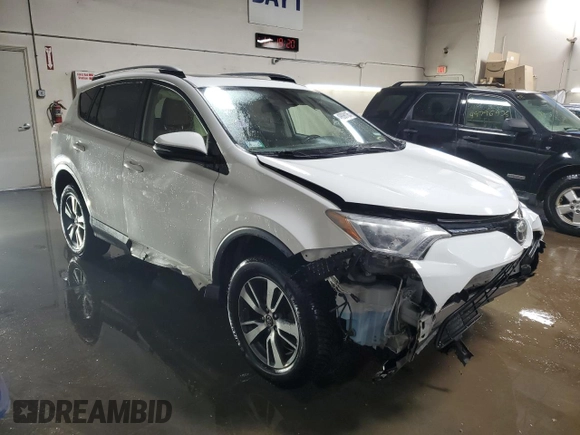 2017 Toyota RAV4 XLE with VIN JTMWFREV7HJ701268, listed as a Copart auction lot 49098185 with 79,314 mi miles and Salvage Title. Bid and sale history available at DreamBid. Image 4.