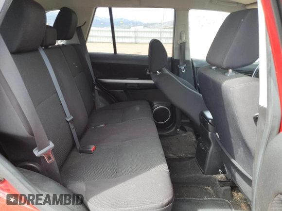 2012 Suzuki Grand Vitara Premium z VIN JS3TD0D20C4101342, wystawiony jako Copart lot #51956595 z przebiegiem 166 710 mil mil oraz Szkody całkowita. Historia ofert i sprzedaży dostępna na DreamBid. Obrazek 11.