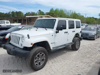 2015 Jeep Wrangler Unlimited Rubicon Hard Rock with VIN 1C4HJWFG7FL684057, listed as a IAAI auction lot 41963885 with 103,240 mi miles. Bid and sale history available at carsss.com. Image 2.