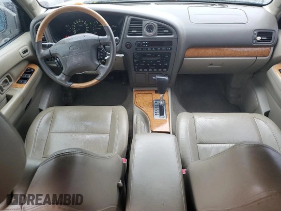 2001 Infiniti QX4 Luxury z VIN JNRDR07X81W103465, wystawiony jako Copart lot #73761114 z przebiegiem 160 676 mil mil oraz Szkody całkowita. Historia ofert i sprzedaży dostępna na DreamBid. Obrazek 8.