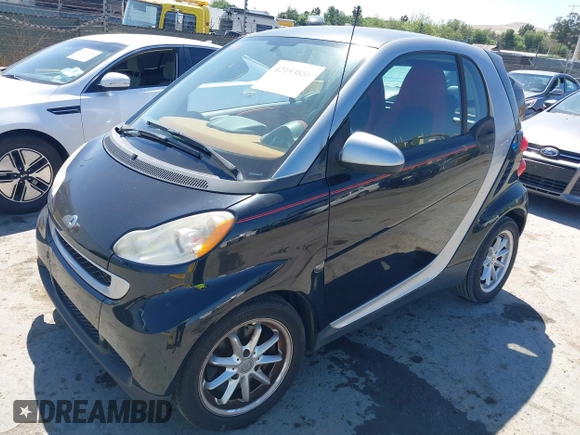 2008 Smart fortwo Pure with VIN WMEEJ31X78K180398, listed as a IAAI auction lot 42193886 with 98,136 mi miles and . Bid and sale history available at DreamBid. Image 2.