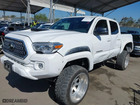 2020 Toyota Tacoma 4WD SR5 with VIN 3TMCZ5AN5LM305778, listed as a IAAI auction lot 42004484 with 27,991 mi miles. Bid and sale history available at carsss.com. Image 18.