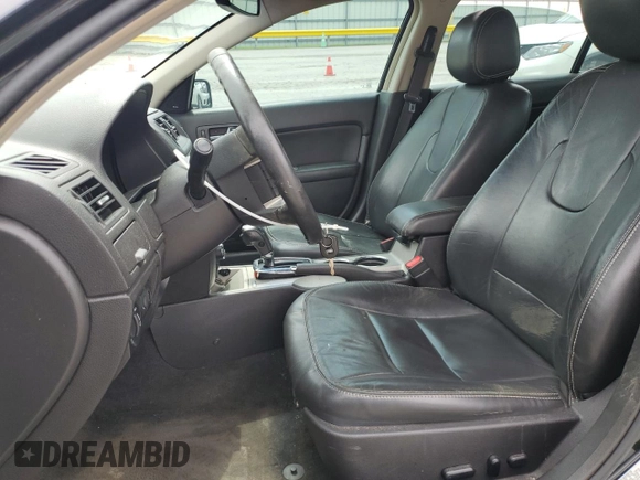 2012 Ford Fusion SEL with VIN 3FAHP0JA0CR386841, listed as a Copart auction lot 61587325 with 129,572 mi miles and Salvage title. Bid and sale history available at DreamBid. Image 7.
