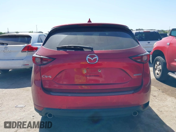 2021 Mazda CX-5 Grand Touring with VIN JM3KFADM4M0476615, listed as a IAAI auction lot 42004814 with 42,483 mi miles. Bid and sale history available at carsss.com. Image 16.