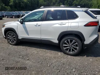 2023 Toyota Corolla Cross XLE with VIN 7MUDAABGXPV060797, listed as a Copart auction lot 62110665 with 18,293 mi miles and Salvage title. Bid and sale history available at DreamBid. Image 2.