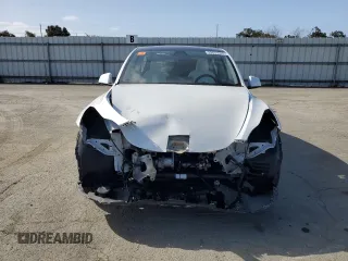 2021 Tesla Model Y Standard Range z VIN 5YJYGDED9MF110473, wystawiony jako Copart lot #53850085 z przebiegiem 46 242 mil mil oraz Szkoda całkowita • Salvage title. Historia ofert i sprzedaży dostępna na DreamBid. Obrazek 5.