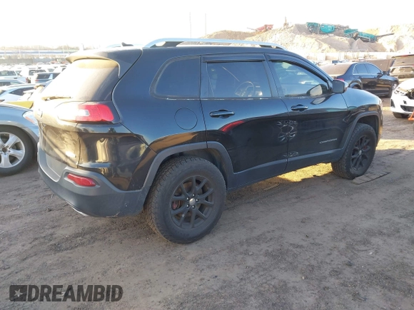 2015 Jeep Cherokee Latitude with VIN 1C4PJMCS0FW745949, listed as a IAAI auction lot 41289847 with 137,440 mi miles and . Bid and sale history available at carsss.com. Image 4.