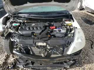 2009 Nissan Versa S z VIN 3N1BC13E89L383363, wystawiony jako Copart lot #72003164 z przebiegiem 104 953 mil mil oraz Szkoda całkowita • Salvage title. Historia ofert i sprzedaży dostępna na DreamBid. Obrazek 11.