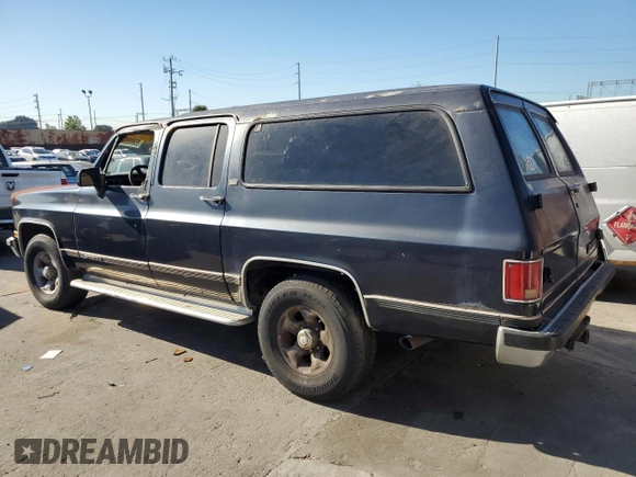 1991 Chevrolet Suburban z VIN 1GNGR26N2MF124400, wystawiony jako Copart lot #85809994 z przebiegiem 160 922 mil mil oraz Czysty tytuł • Clean title. Historia ofert i sprzedaży dostępna na DreamBid. Obrazek 2.