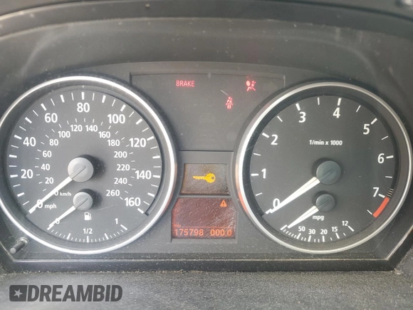 2007 BMW 3 Series 328xi with VIN WBAVC93567KX55335, listed as a Copart auction lot 60911515 with 175,798 mi miles and Salvage title. Bid and sale history available at DreamBid. Image 9.