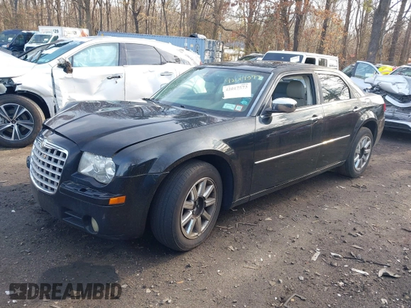 2009 Chrysler 300 Limited with VIN 2C3KA33V59H570460, listed as a IAAI auction lot 42017573 with 130,600 mi miles. Bid and sale history available at carsss.com. Image 2.