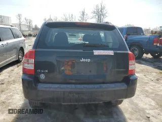2010 Jeep Compass Sport with VIN 1J4NF4FB2AD591523, listed as a Copart auction lot 48809775 with 105,720 mi miles and Salvage Title. Bid and sale history available at carsss.com. Image 6.