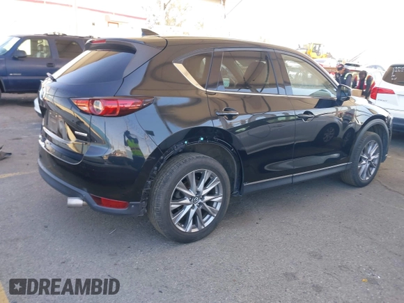 2020 Mazda CX-5 Grand Touring z VIN JM3KFADMXL0740144, wystawiony jako IAAI lot #41830203 z przebiegiem 70 535 mil mil oraz . Historia ofert i sprzedaży dostępna na DreamBid. Obrazek 4.