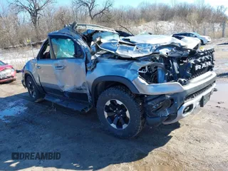 2022 Ram 1500 Rebel z VIN 1C6SRFLT7NN196608, wystawiony jako IAAI lot #41840099 z przebiegiem Nie podano mil oraz . Historia ofert i sprzedaży dostępna na DreamBid. Obrazek 1.